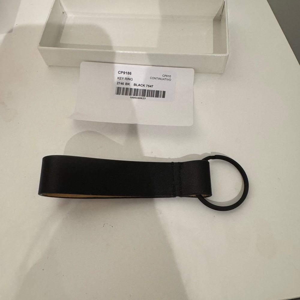 Brand new common projects key ring. in box. purchased on SSENSE